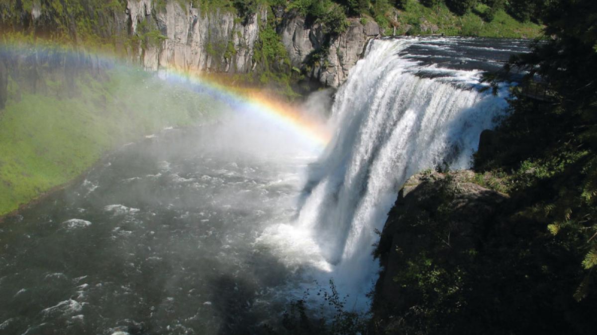 A rainbow in the mist below Upper Mesa Falls