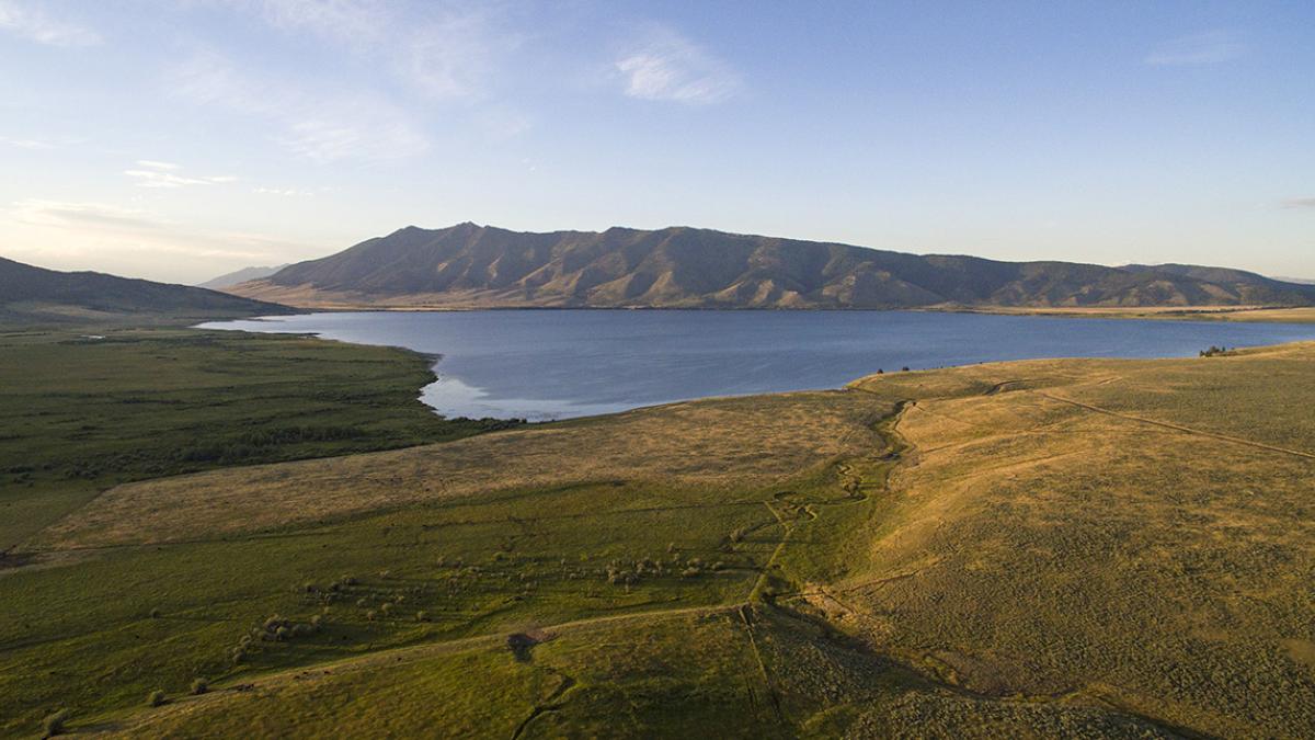 Henry's Lake in its wide mountain basin at sunset