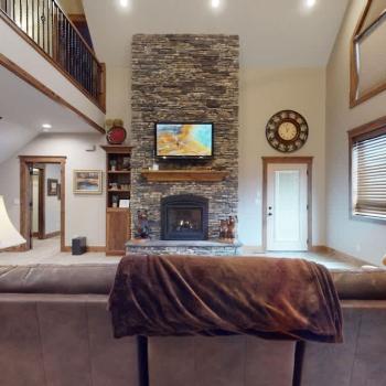 Large windows illuminate the area making it feel like the perfect cozy space.