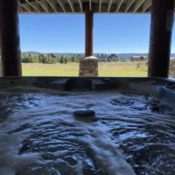 Large hot tub overlooking the beautiful landscape.