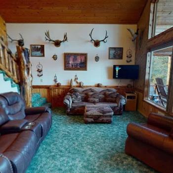 Upon entrance of the cabin you are welcomed by the living room.