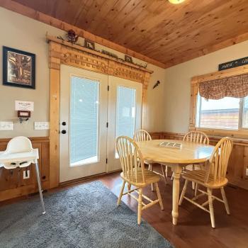 Beautiful open entrance to the cabin to the first dining table with seating for 4.