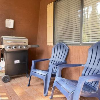 chairs and grill on the front deck.