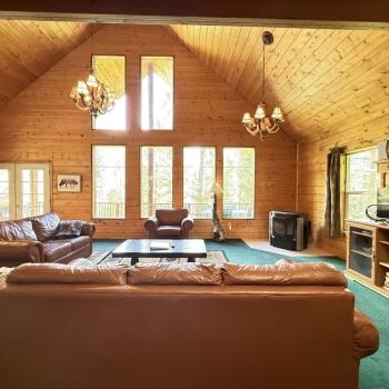 Spacious living room with fireplace for you to cozy up after a long day.