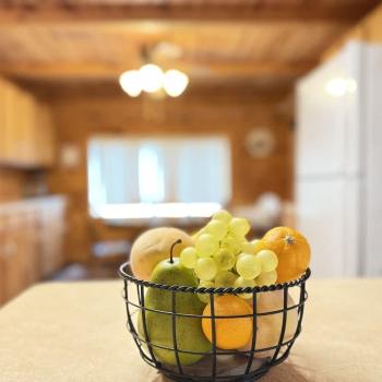 Fruit basket with view of the kitchen.