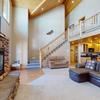 Natural light pours in through large windows, tying it all together with a view of the forest just beyond.