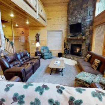 Upon entrance you are greeted by the living room that is very open to the rest of the cabin.