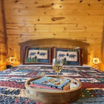 Relax in bed with a glass of wine and a good book.