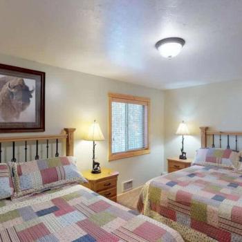 Bedroom #1 located on the main floor with 2 Queen size bed.