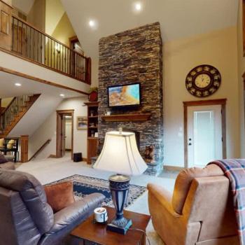 Large windows illuminate the area making it feel like the perfect cozy space.