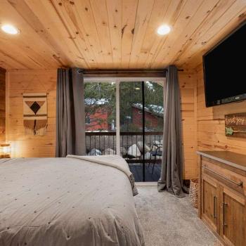 The main level bedroom has a small private porch.