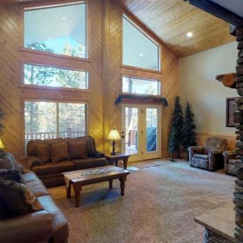Natural light pours in through large windows, tying it all together with a view of the forest just beyond.