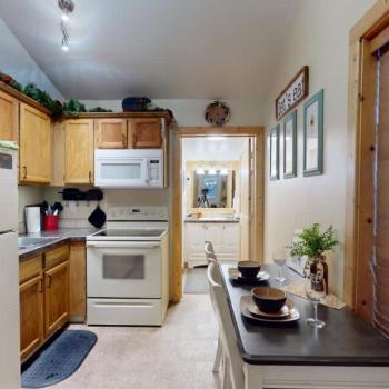 When you enter you are greeted by the kitchen and dining area.