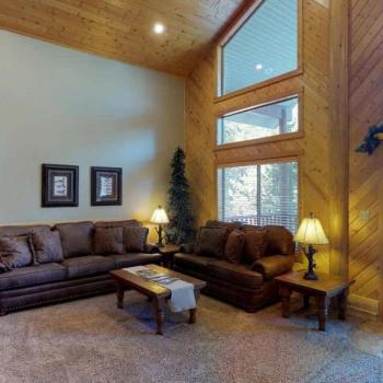 Living room is set up with lots of seating for everyone to relax during your stay.