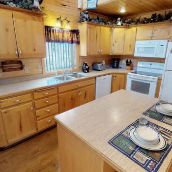 Full size kitchen with appliances, cookware, pots and pans, dishes, utensils, and basic cooking essentials.