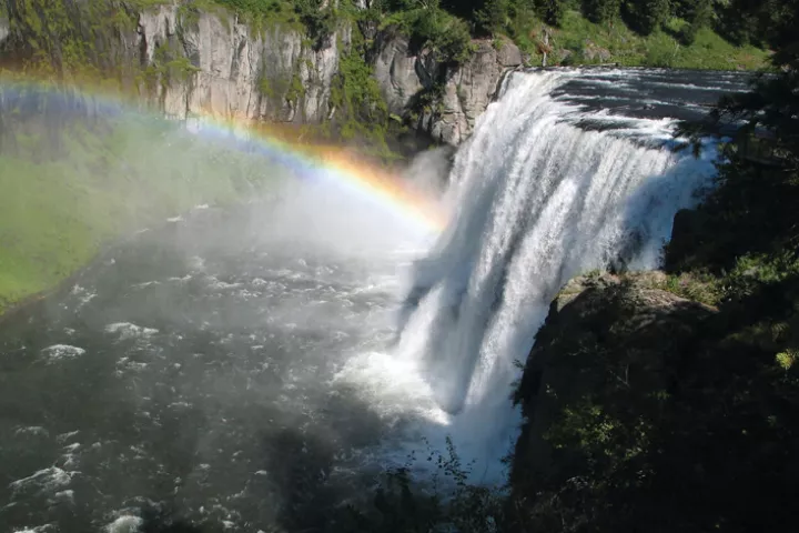 A rainbow in the mist below Upper Mesa Falls