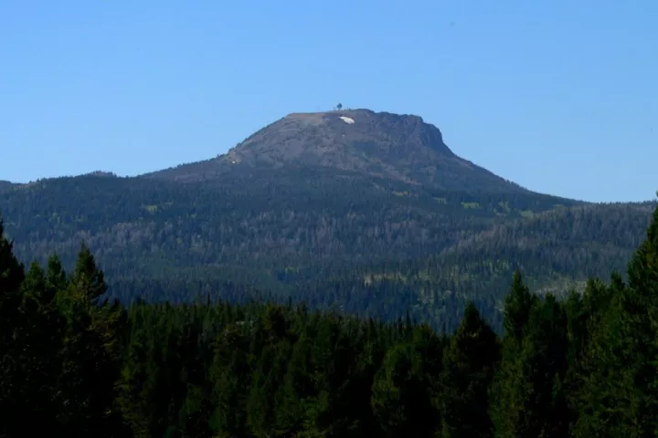 Sawtelle Peak rising above the forests of Island Park