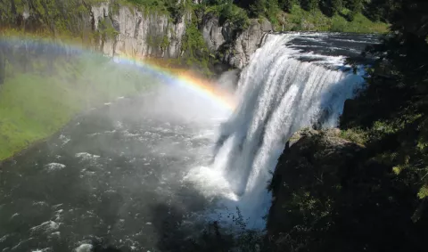 A rainbow in the mist below Upper Mesa Falls