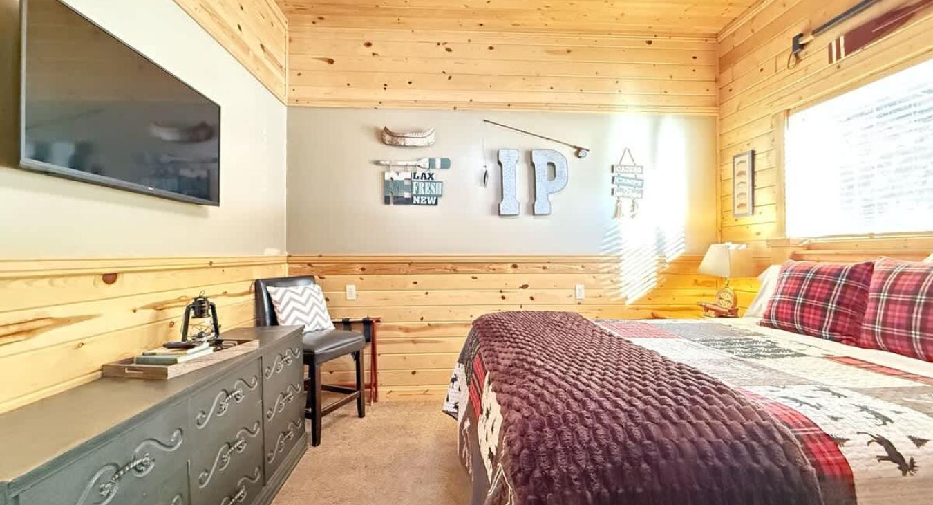 Imagine a cozy cabin bedroom that instantly makes you want to curl up and stay awhile.