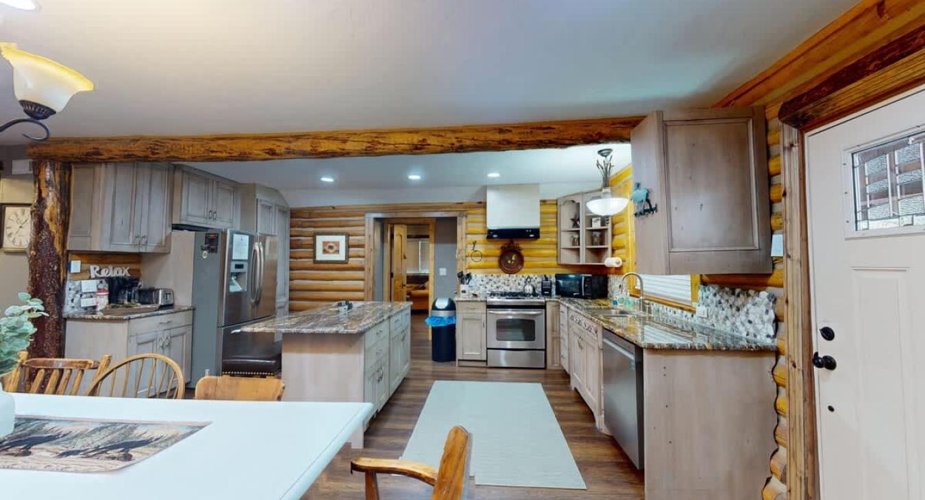 Full size kitchen with appliances, pots and pans, dishes, utensils, and basic cooking essentials.