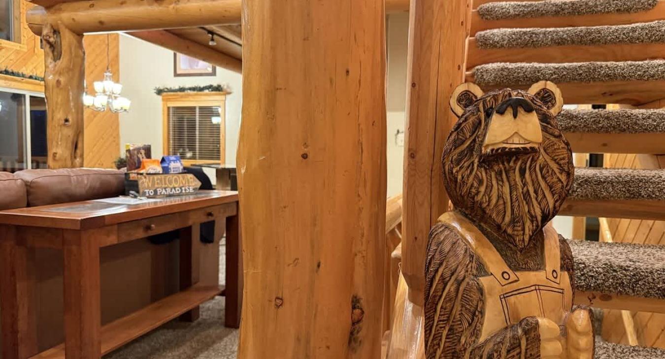 Alright, let's head upstairs—you're in a loft tucked under a pitched cabin roof, and it’s got that perfect blend of chill and fun.