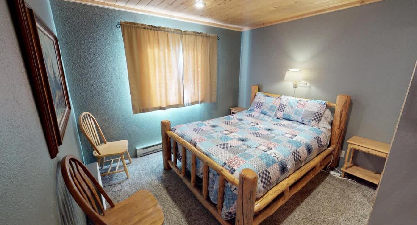 Bedroom #1 located on the main level with a Queen size bed.