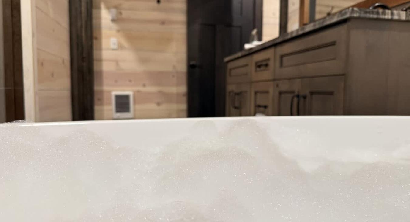 Take a long soak in the soaker bathtub in the master shared bathroom.