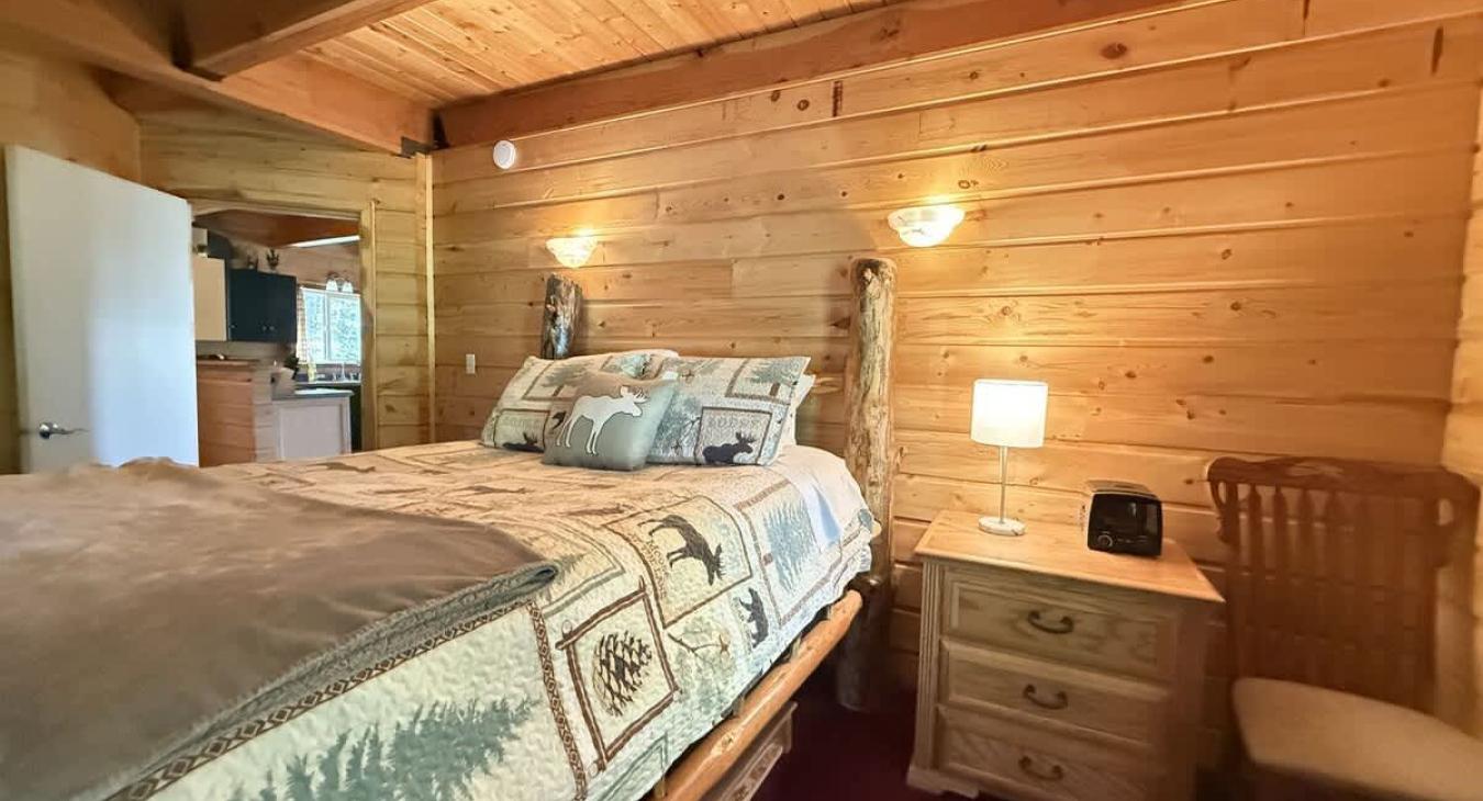 Master bedroom with queen bed and ensuite bathroom.