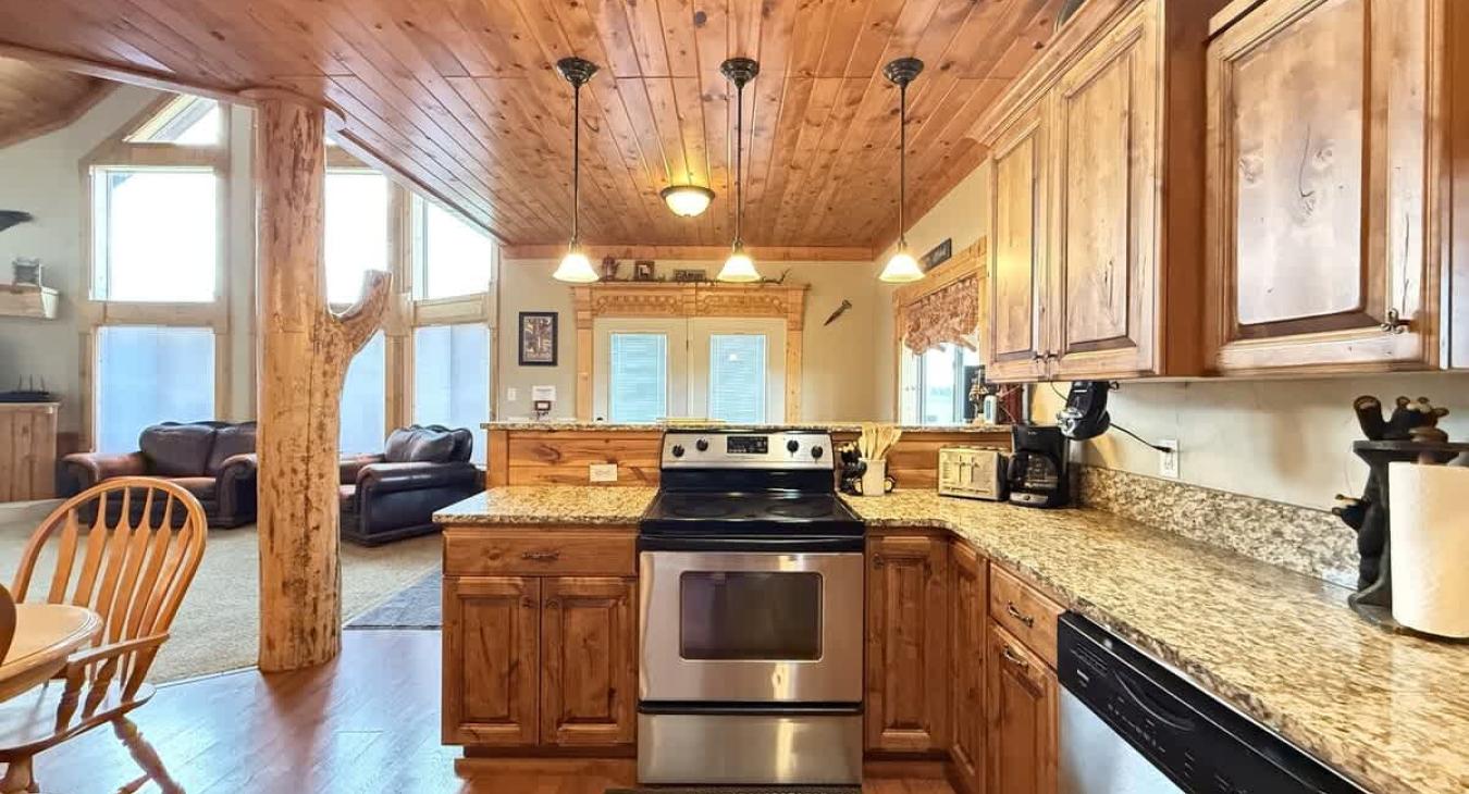 Beautiful open kitchen with stainless steel appliances.