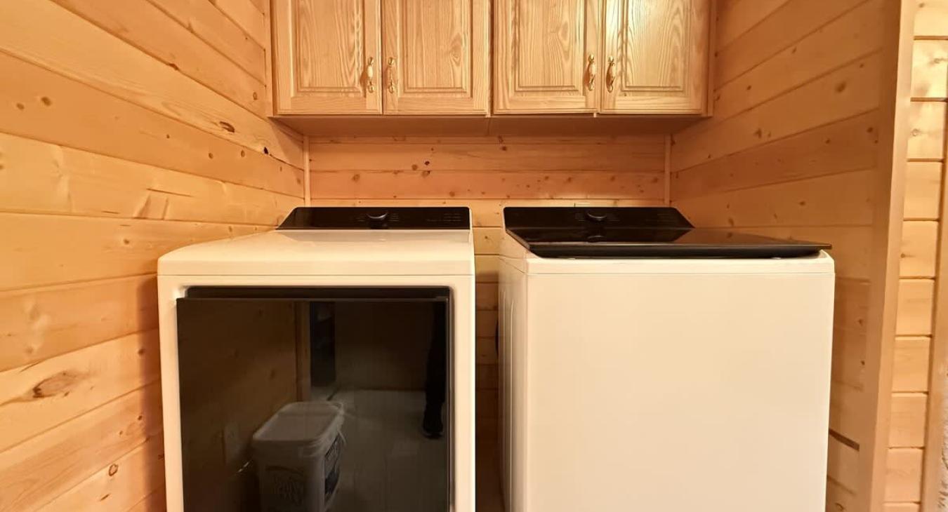 Full size washer and dryer, laundry soap is provided.