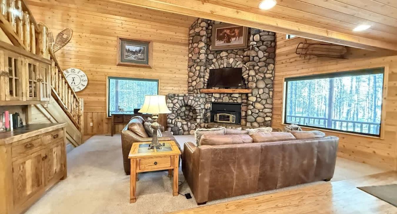 Main level living room with fireplace. Make sure to bring your own firewood.