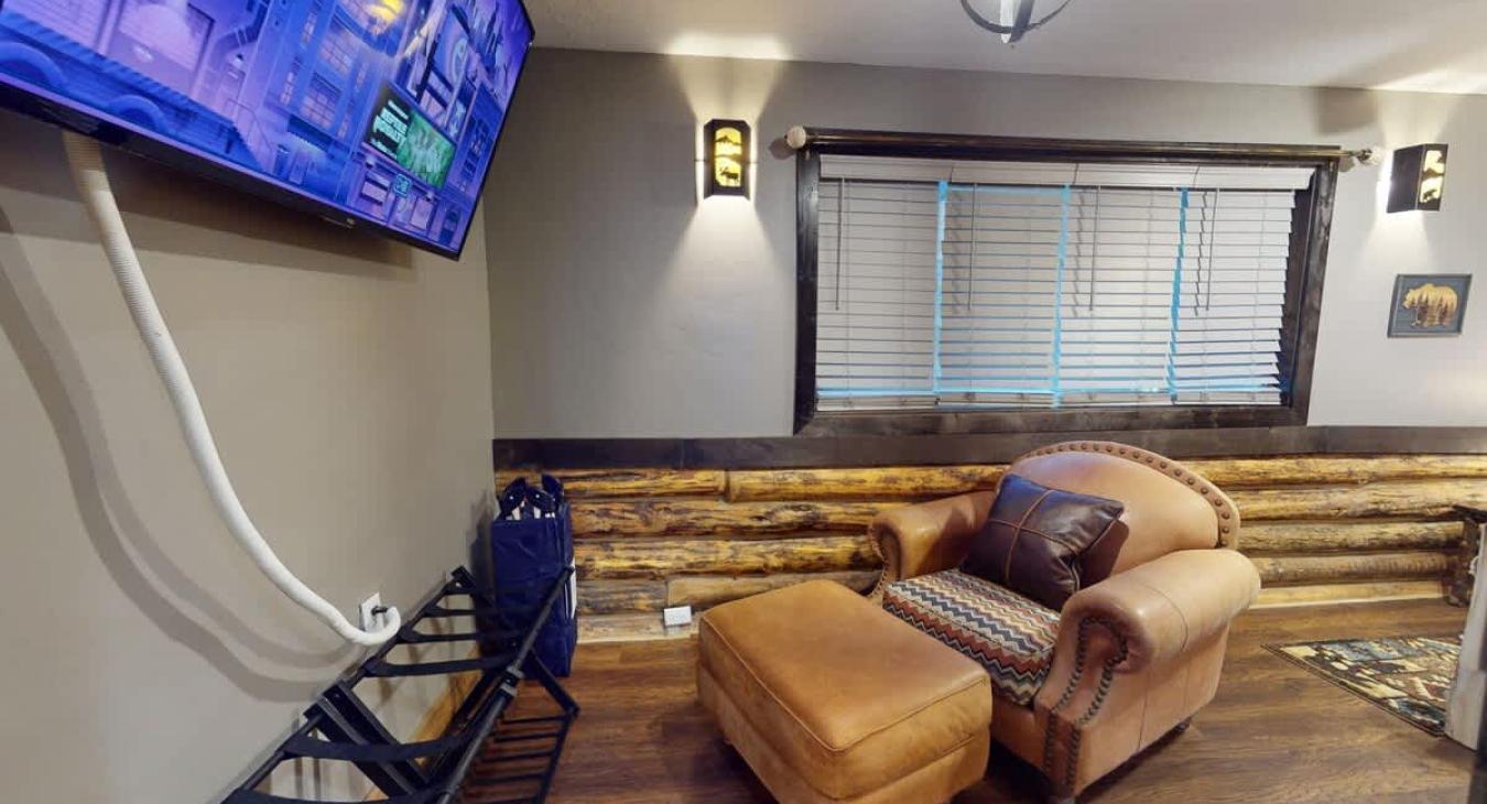 Large open room with additional seating and tv for entertainment.