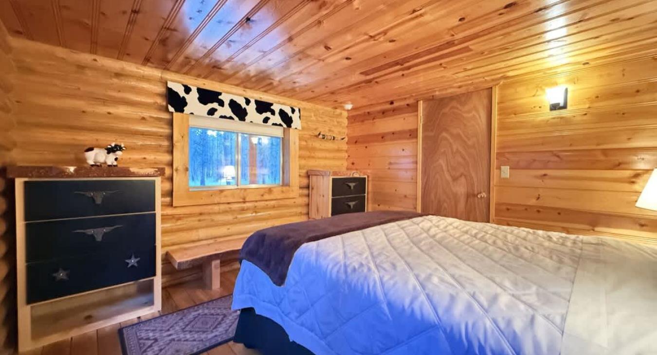 Main bedroom with queen bed and storage for you to use during your stay.