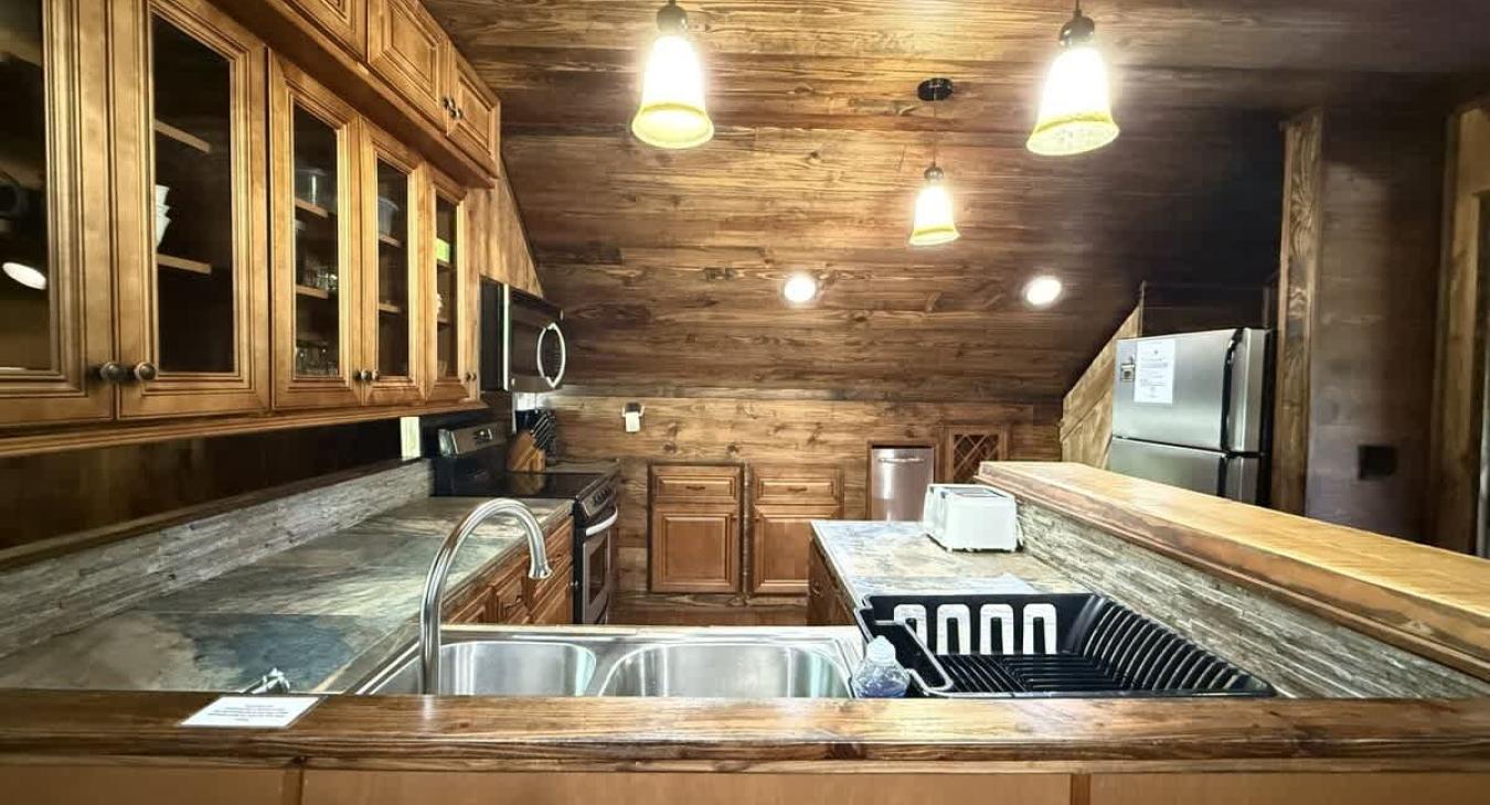 Full size fridge in the kitchen.