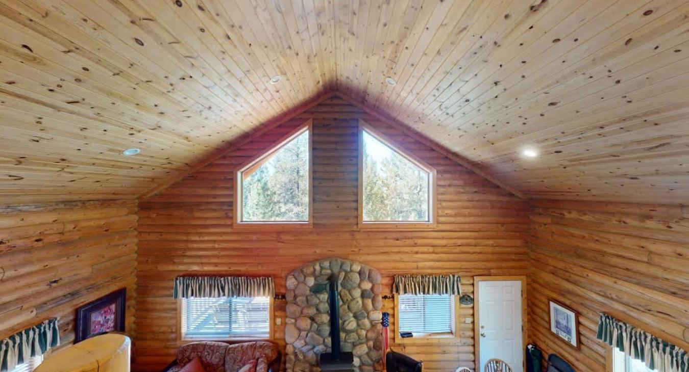 Natural light pours in through large windows, tying it all together with a view of the forest just beyond.