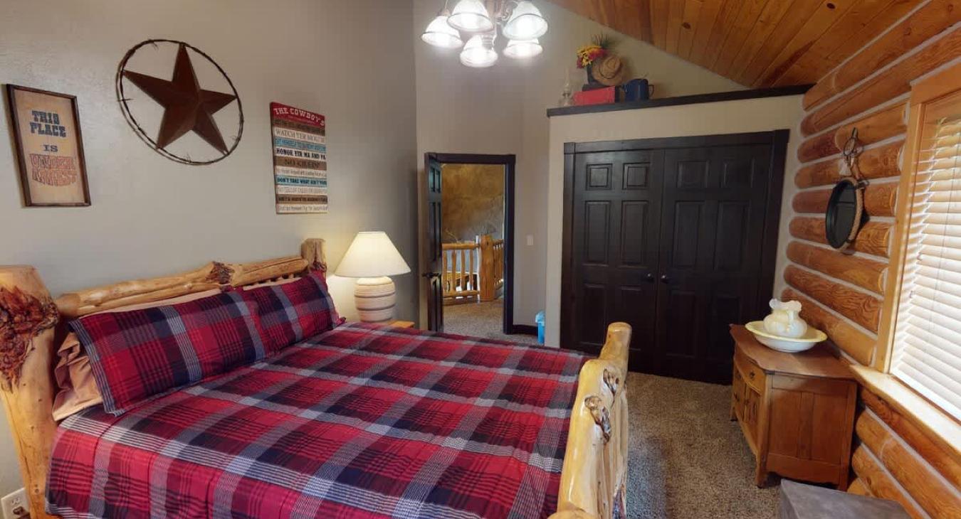 Bedroom 3 located upstairs with a Queen size bed.