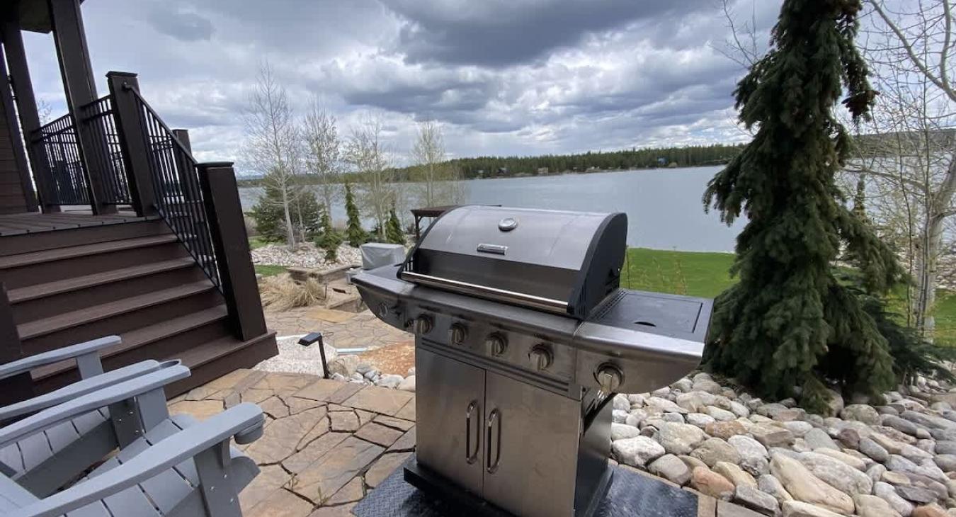 A grill is located outside for the perfect barbeque.