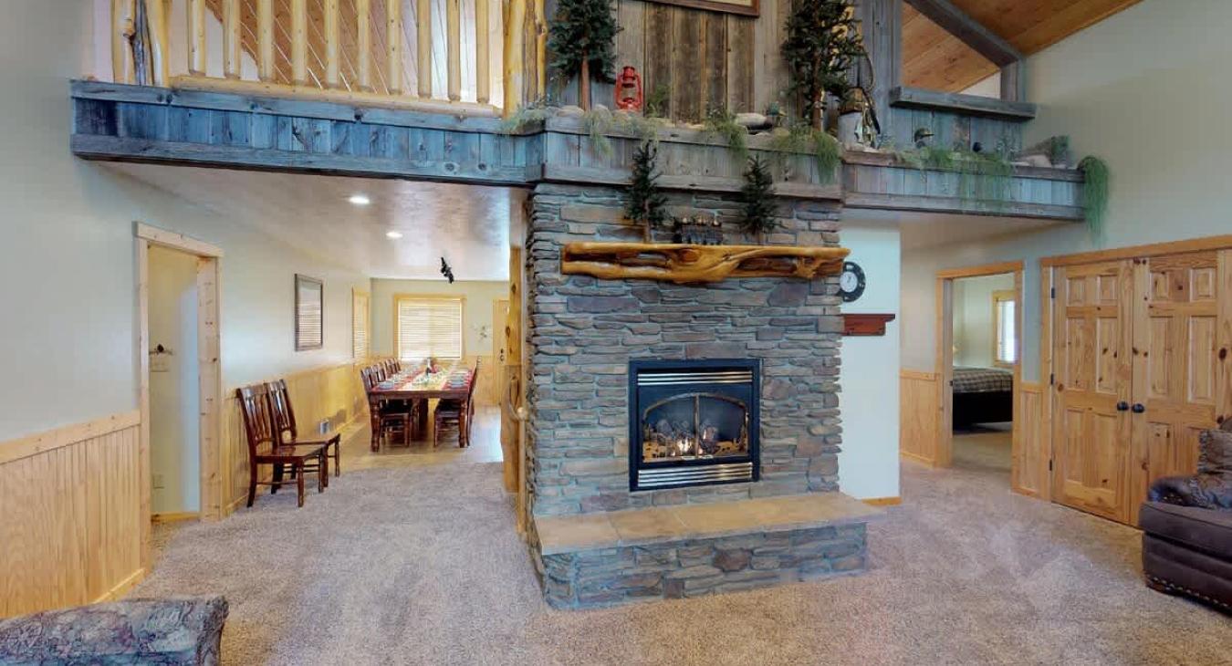 Main level living room with a fireplace, make sure to bring your own wood.