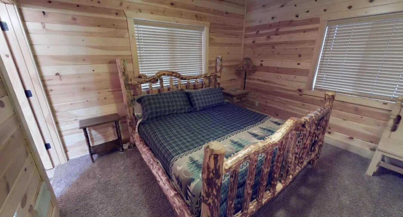 Master bedroom located on the main floor with a King size bed.