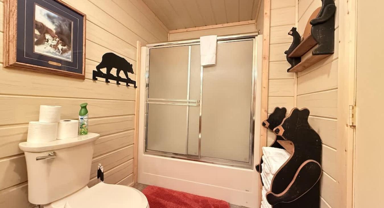 Common bathroom in the hallway. Spacious countertop and full tub and shower.