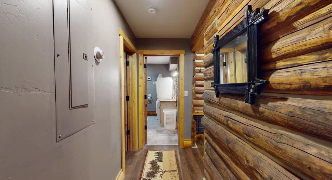 Access to the bathroom and bedrooms from the hallway.