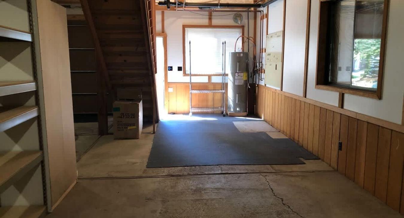 Open garage area below the cabin.