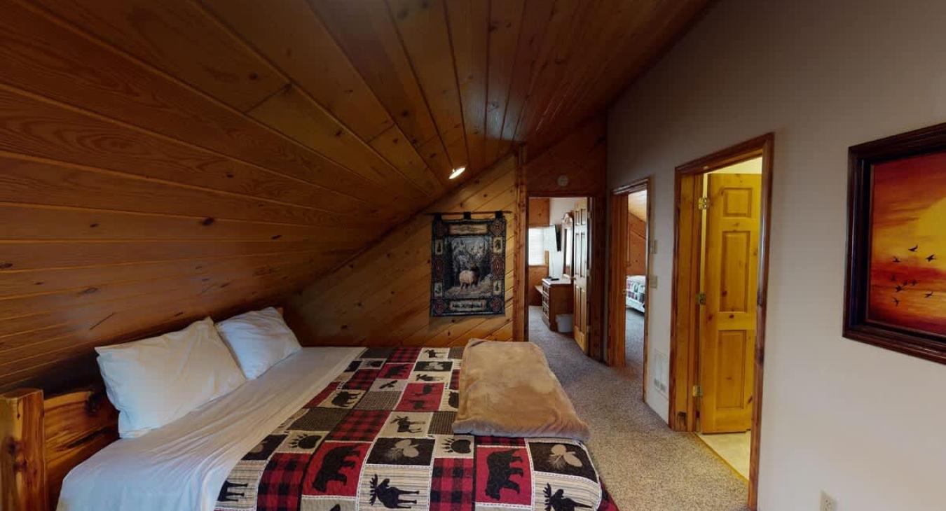 Upstairs loft with a queen bed.