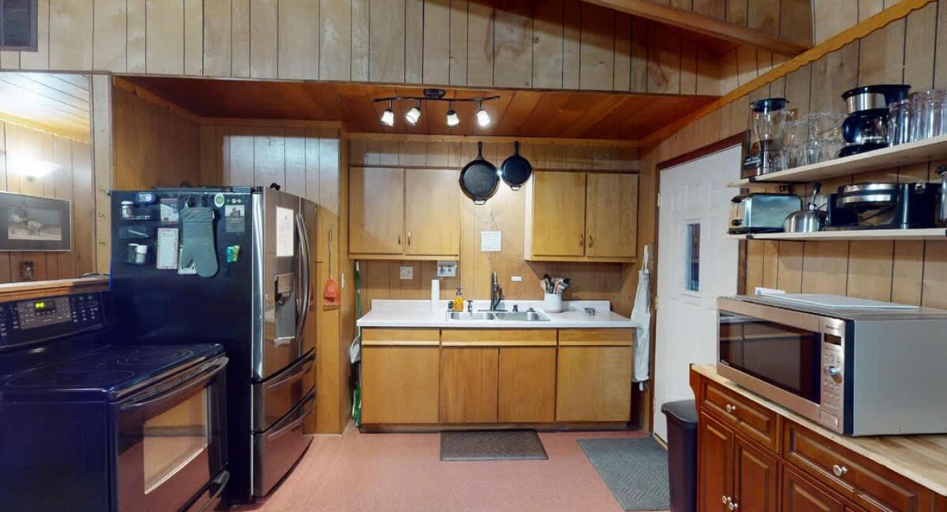 Some appliances included are a blender, coffee maker, waffle iron, and toaster. Along with dishes, silverware, cookware, and utensils.