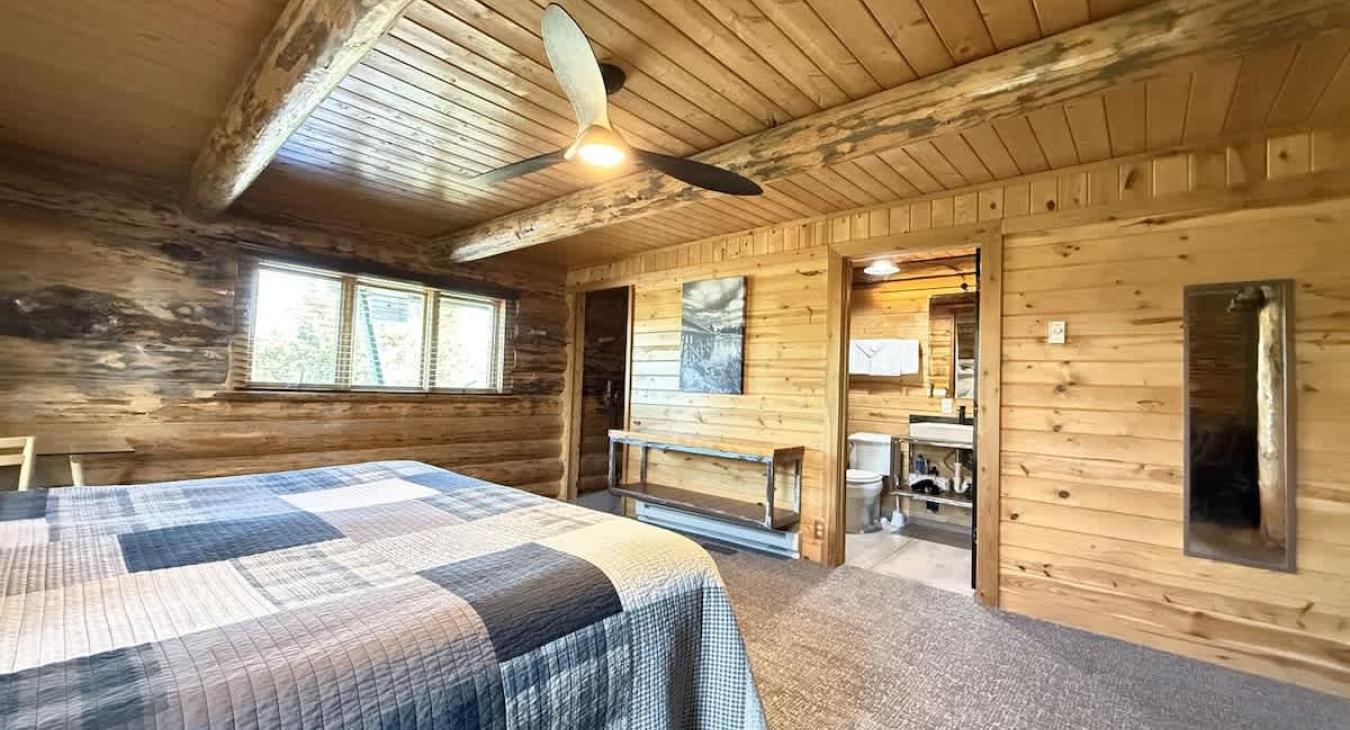 Multiple windows are placed in this room to bring in natural light.