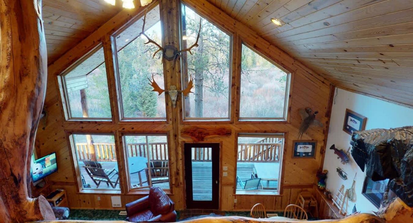 Natural light pours in through large windows, tying it all together with a view of the forest just beyond.