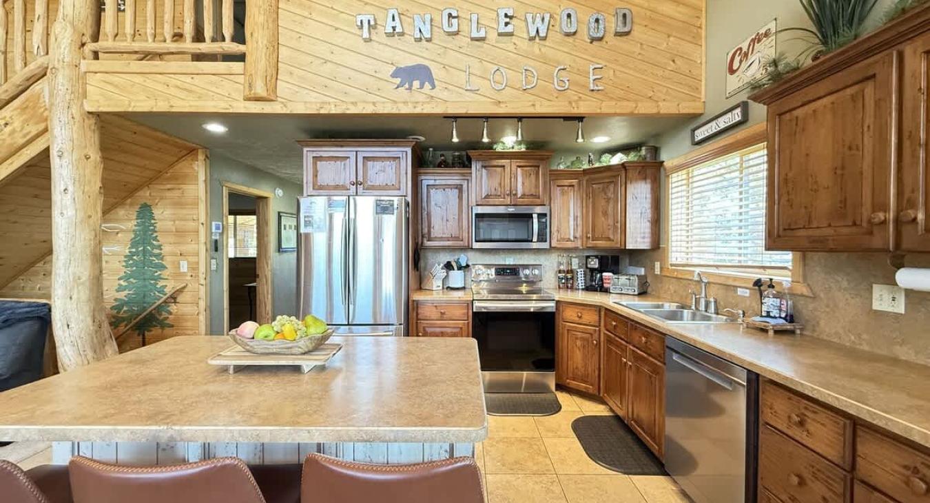Full kitchen with appliances, cookware, dishes, silverware, and basic spices.