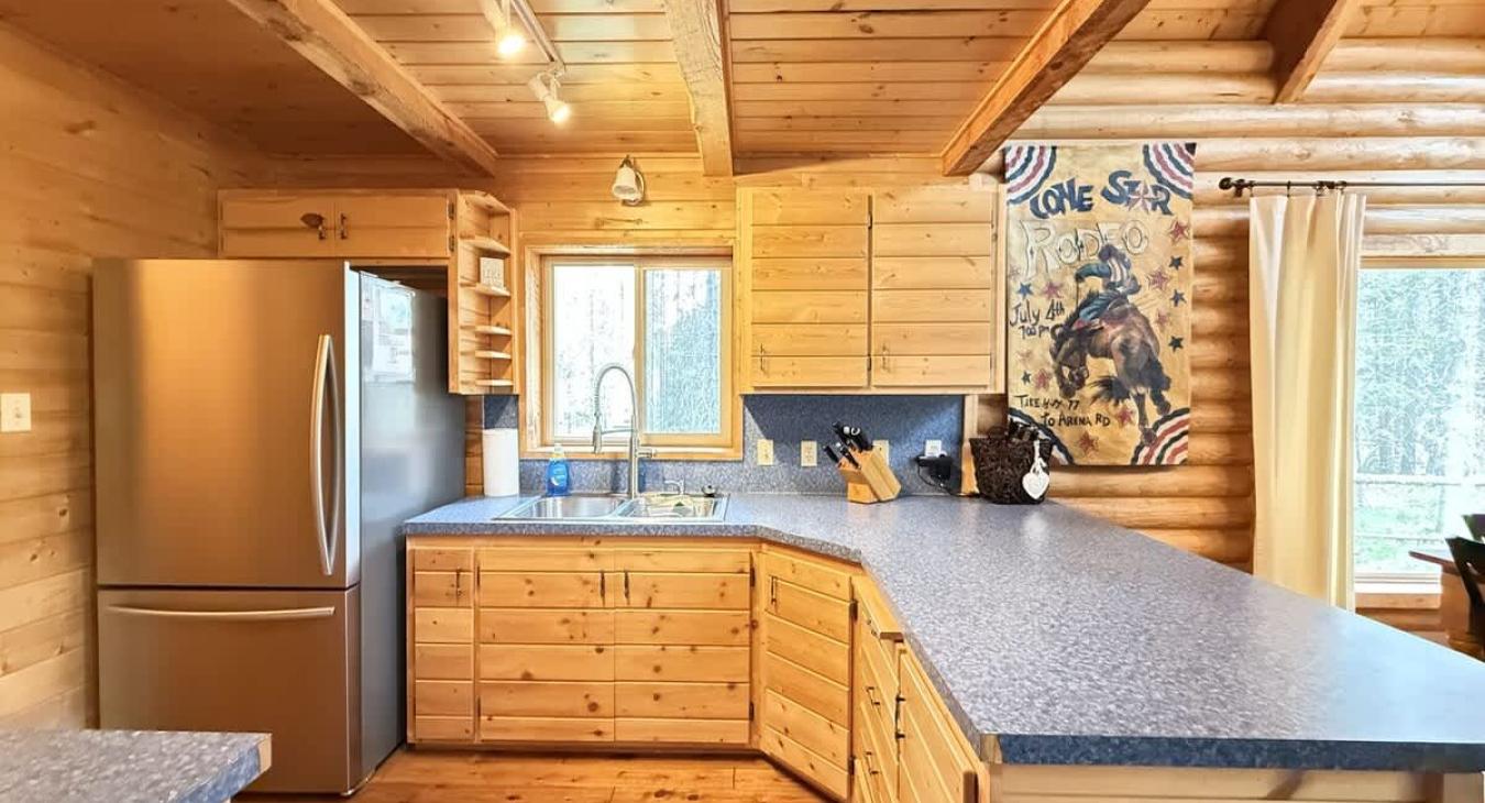 Full size kitchen with appliances, pots and pans, dishes, utensils, and basic cooking essentials.