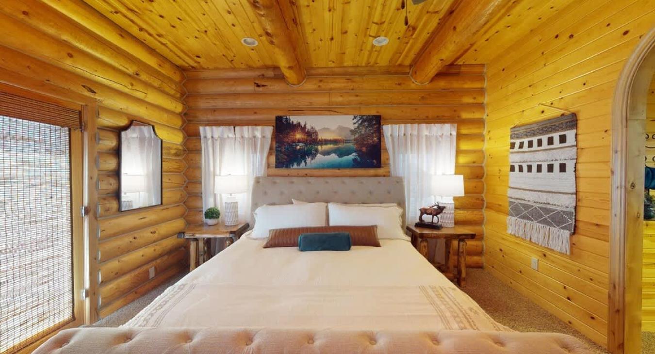 Natural light streams through the doors, brightening the room and blurring the boundaries between indoor and outdoor living, making the room feel even more expansive and connected to nature.