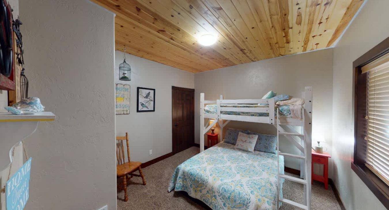 2nd Bedroom located downstairs with 1 Twin over Queen bunk bed.